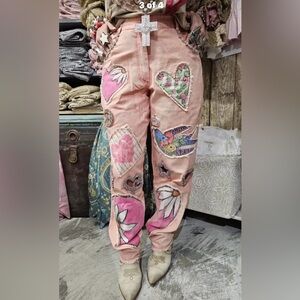 A Rare Bird patchwork, rhinestone cut-out pink jeans.  NWT